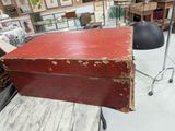 a red box sitting on top of a table in a room
