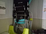 a chair that is next to a chair in a room