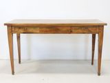 an old wooden table with two drawers on top of it