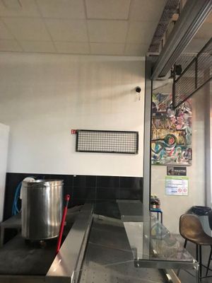 an image of a kitchen with a large stainless steel counter top