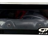 the box is open to show the model of a sports car