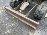a picture of a bulldozer that is sitting on the ground
