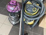 two vacuums that are on the floor next to each other