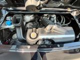 a picture of a car ' s engine with its hood open