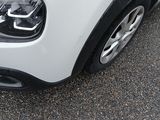 a close up of a car ' s headlight on a parking lot