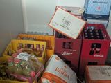 many boxes of food and a laptop on the floor