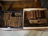 a box full of old books sitting on a table