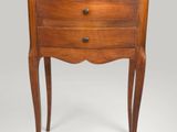 an old wooden chest of drawers with a drawer underneath it