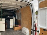 a white van with a refrigerator in the back of it