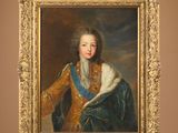 tableau représentant un jeune homme vêtu d'un manteau bleu et or, tenant un chat blanc dans ses bras
