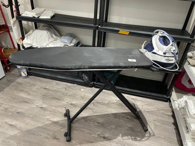a ironing board on a ironing board stand in a room