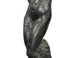 statue of a man with a hat on his head on a base