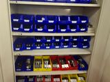 many bins of tools on the shelves in the garage