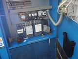 a blue machine that is sitting in a room