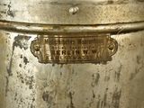 a metal container that has a label on it