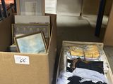 two boxes with clothes and pictures on them in a room