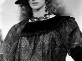 black and white photograph of a woman wearing a hat and scarf