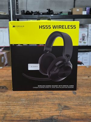 a box with a pair of headphones sitting on top of a wooden table
