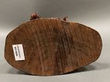 an image of a piece of wood with a label on it