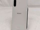 a close up of the back of a white sony phone