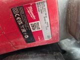 a close up of a red machine with a sticker on it