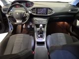 the interior of a car with a steering wheel, dashboard, and dashboard controls