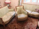 two couches and a chair in a living room