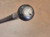 a baseball bat with a ball on it on a table