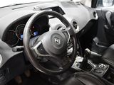a steering wheel and dashboard of a car in a car showroom