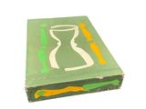 a green box with a picture of a vase on it