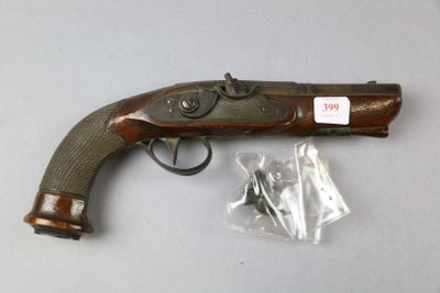 an old gun that is sitting on top of a table