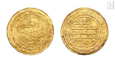 two gold coins with arabic writing on them