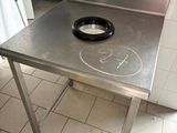 a stainless steel table with a bowl on it