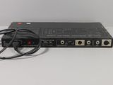 a close up of a remote control unit sitting on a table