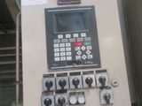 a machine that is sitting on the side of a building