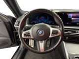 the interior of a bmw car with a steering wheel and dashboard