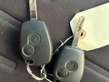 two car keys that are attached to a car key chain