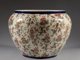 a vase with a floral design on it on a table