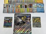 a lot of different pokemon cards on the table