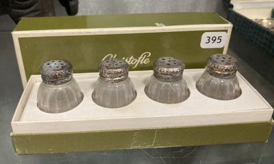 three salt and pepper shakers in a box