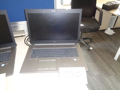 two laptops that are sitting on a desk