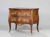an old wooden chest of drawers with a marble top