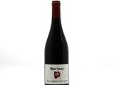 a bottle of wine that is sitting on a table