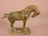 a statue of a horse with a saddle on it ' s back