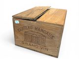 a wooden box with a label on it that says chateau margaux grand vin