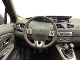 a picture of the interior of a car with a steering wheel