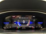 the dashboard of a car with a digital display in the center of it