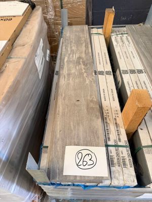 several boxes of wood are stacked on top of a pallet