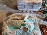 many bags of items that are sitting on the floor