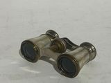 a pair of binoculars that are sitting on a table